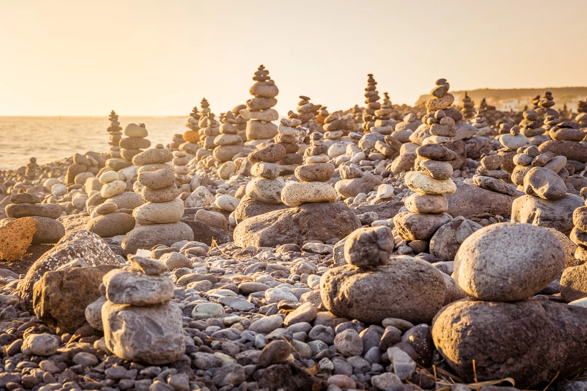 Balanced stones in sunset on the beach